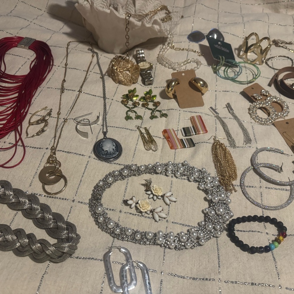 Lot of jewelry and watch/ earrings , necklaces, and bracelets